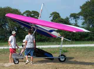 A hang glider on a cart, during takeoff